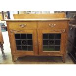 An Edwardian oak sideboard, having two f