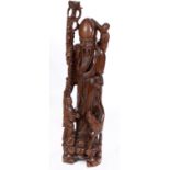 A carved hardwood Chinese Shou Lou figur