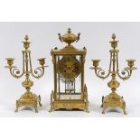 A clock garniture, the clock having a 9