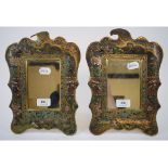 A pair of brass and enamel strut mirror