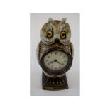 A clock, in a painted metal owl case, 17