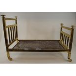 A miniature brass bed, 27.5 cm wide