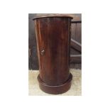 A mahogany cylindrical bedside cupboard,