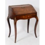 A Louis XVI style rosewood lady's writing desk, with a brass ¾ gallery,