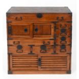 A Korean style cabinet, having an arrangement of drawers and doors, with metal mounts,