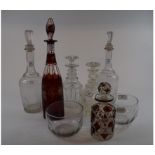 A ruby flashed glass decanter and stopper, etched grapes and vines, 36 cm high,