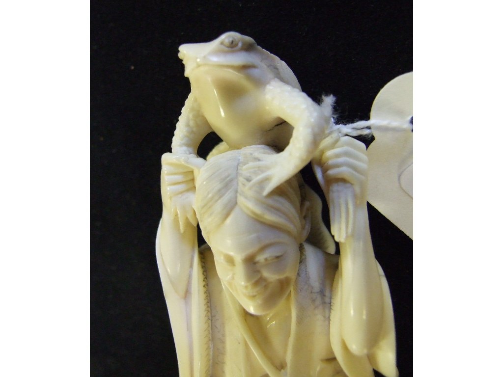 A Japanese carved ivory figure, holding a toad aloft, on a plinth base, 14. - Image 20 of 27