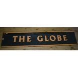 An enamel pub type sign, The Globe, on a green ground with orange lettering,