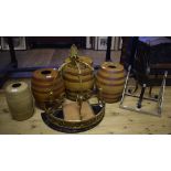 A set of three graduated stoneware barrels, the tallest 49 cm high, another,
