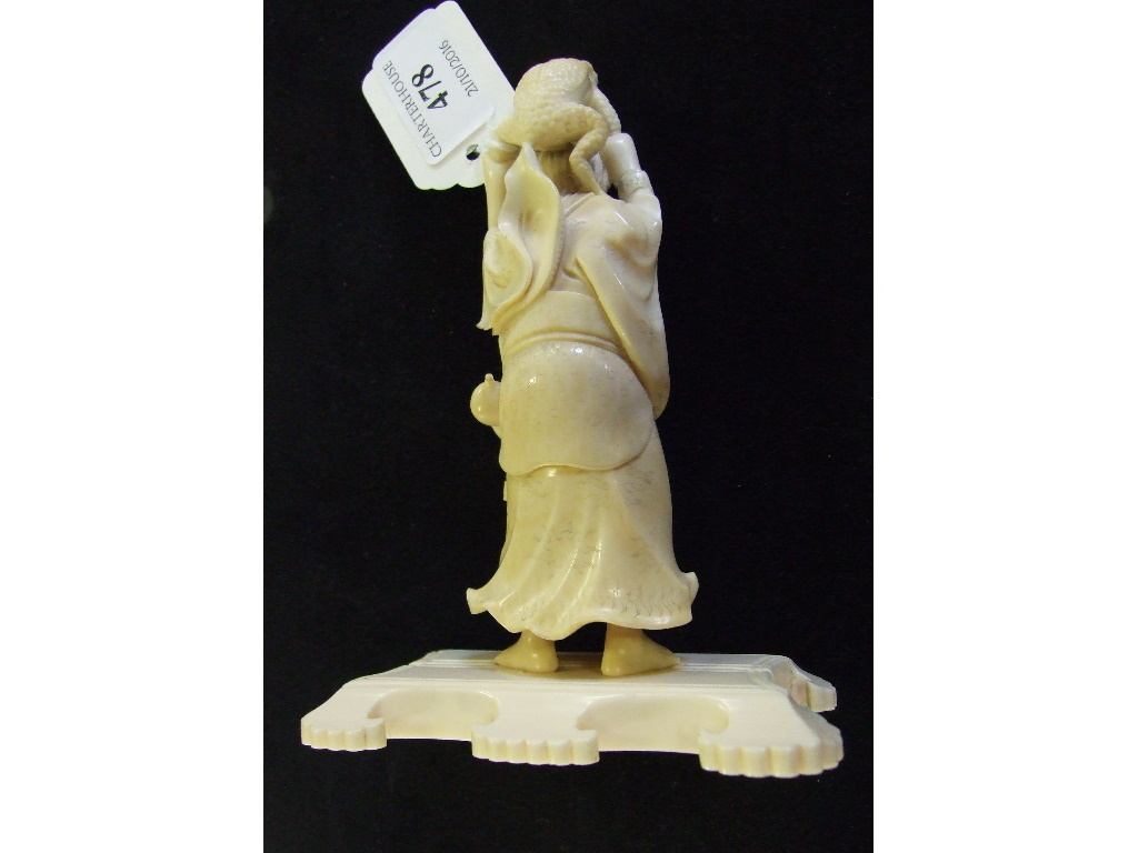 A Japanese carved ivory figure, holding a toad aloft, on a plinth base, 14. - Image 14 of 27