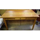 A kitchen table, with a frieze drawer, on tapering square legs, 150 cm wide,