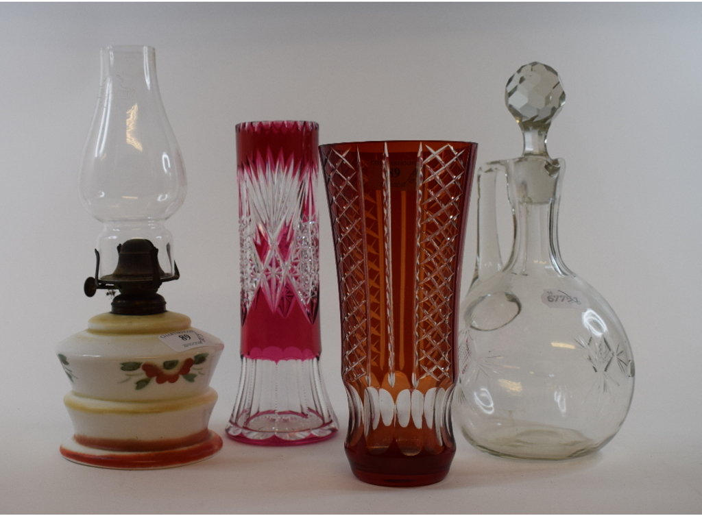 A pair of cranberry glass vases, two glass flasks, a decanter and stopper,