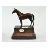 A bronzed racehorse, on a plinth, 22.