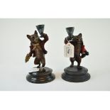 A figural painted metal candlestick, in the form of a bear, 17 cm high, and another,