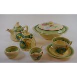 A Clarice Cliff Honeydew teapot and cover, 12 cm high, a similar milk jug and sugar bowl,