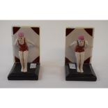A pair of porcelain bookends, in the form of swimmers,