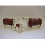 A Beswick Hereford Bull, 1363A, a Hereford Cow, 1360, and a Hereford Calf, 1406B,