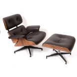 A Charles Eames style laminated and leather upholstered armchair,