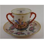 A Naples style porcelain two handled cup and saucer,