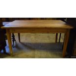 A kitchen table, with a frieze drawer, on tapering square legs,