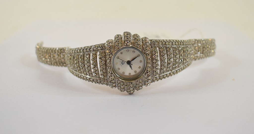 A silver and cubic zirconia cocktail watch