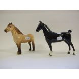 A Beswick Hackney Horse, Black Magic of Mork, black, 1361, and a Highland Pony, dun, 1644,