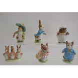 A Beswick Beatrix Potter figure, Tom Kitten, two others, Flopsy, Mopsy and Cottontail,