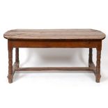 A 19th century French oak farmhouse kitchen table, with two end drawers,