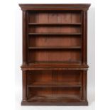 A Victorian mahogany open bookcase, having adjustable shelves flanked by columns, on a plinth base,