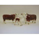 A Beswick Hereford Bull, 1363A, a Hereford Cow, 1360, and a Hereford Calf, 1406B,