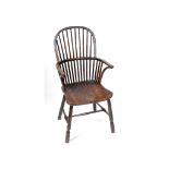 A 19th century comb back kitchen armchair,