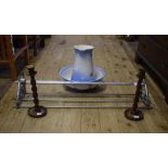 A pair of oak twist candlesticks, 32 cm high, a stainless steel hanging shelf, a wall bracket,