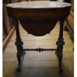 A Victorian inlaid burr walnut work table, of shaped oval form,