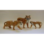 A Beswick Leopard, 1082, a Tiger, 2096, a Tigress, 1486, an Elephant, 974, a Lion, facing left,
