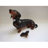 A Beswick Fireside Dachshund, black/tan, 2286, gloss, and another, black/tan, 1460,