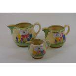 A set of three graduated Newport Pottery Clarice Cliff Spring Crocus pattern jugs,