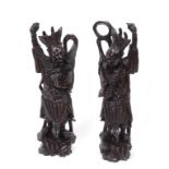 A pair of Chinese carved hardwood figure