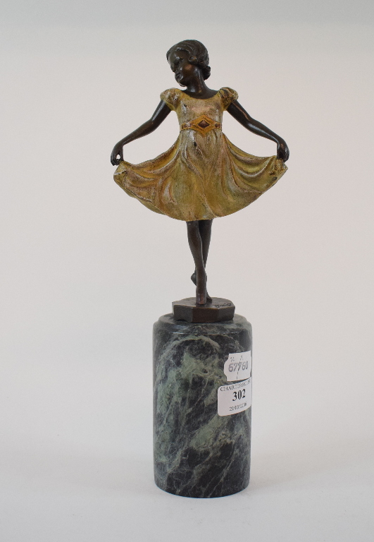 A painted bronzed figure, in the form of