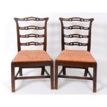 A set of six 19th century mahogany ladder back dining chairs,