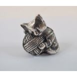 A novelty silver cat and ball of wool pi