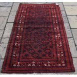 A Beluch tribal rug, of lattice design,