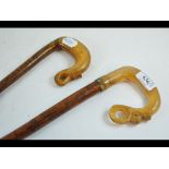 A walking cane, with horn handle carved