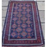 A Baluch rug, with geometric motifs on a