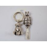 A silver cat rattle, and a bear teether