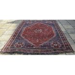 A Persian Qashqai carpet, 284 x 209 cm