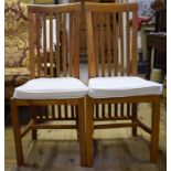 A set of eight teak dining chairs, with