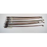 Eight violin bows