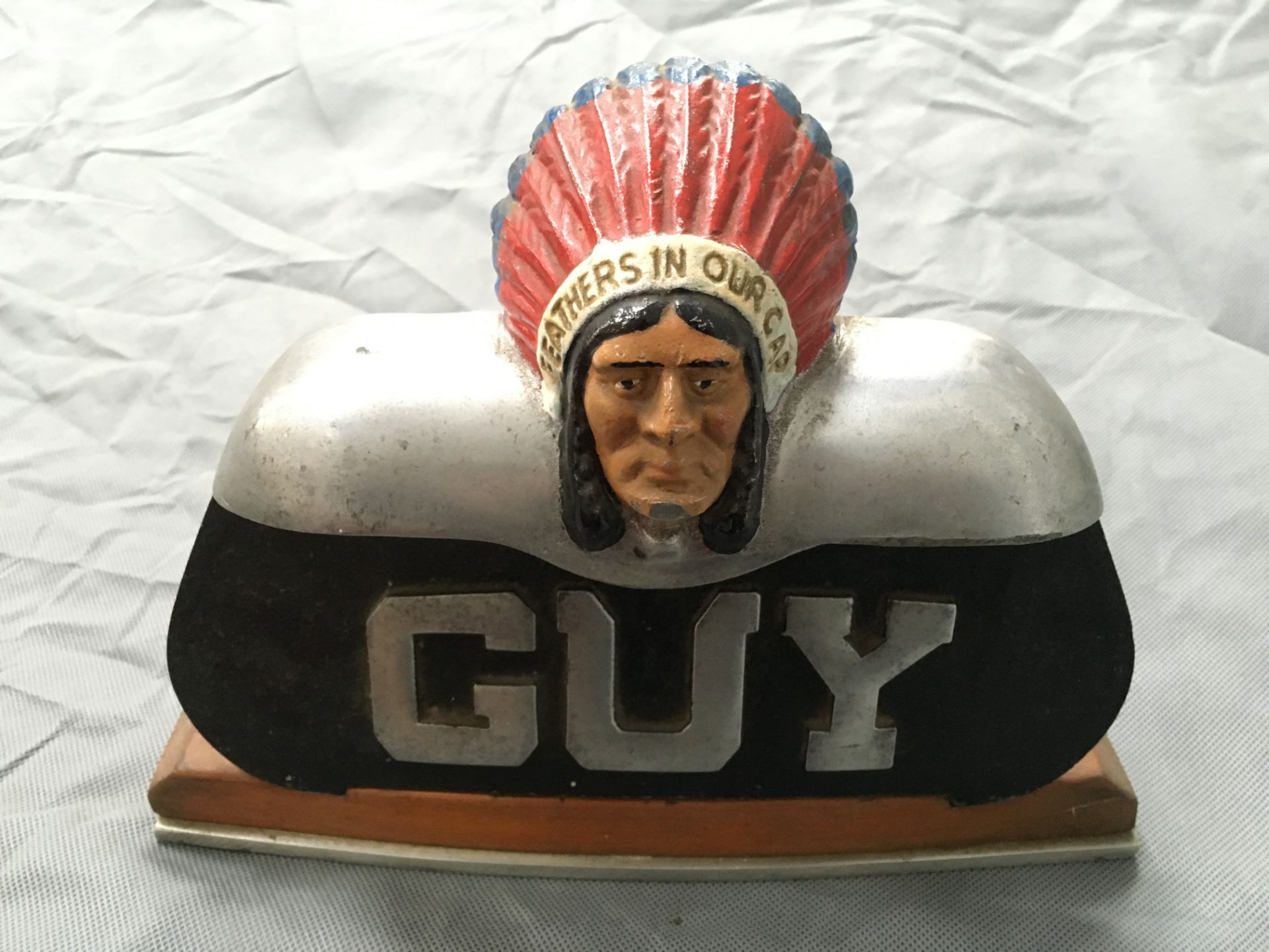 Guy radiator mascot in cast mount