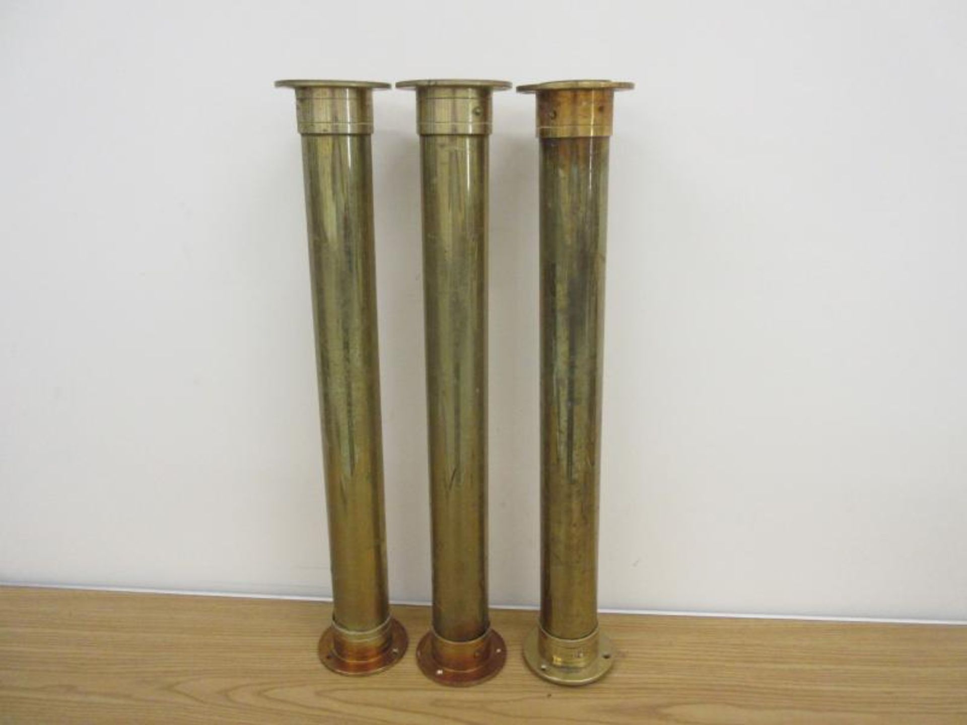 Three brass cylindrical tubes & flanges 29 inches high (3)