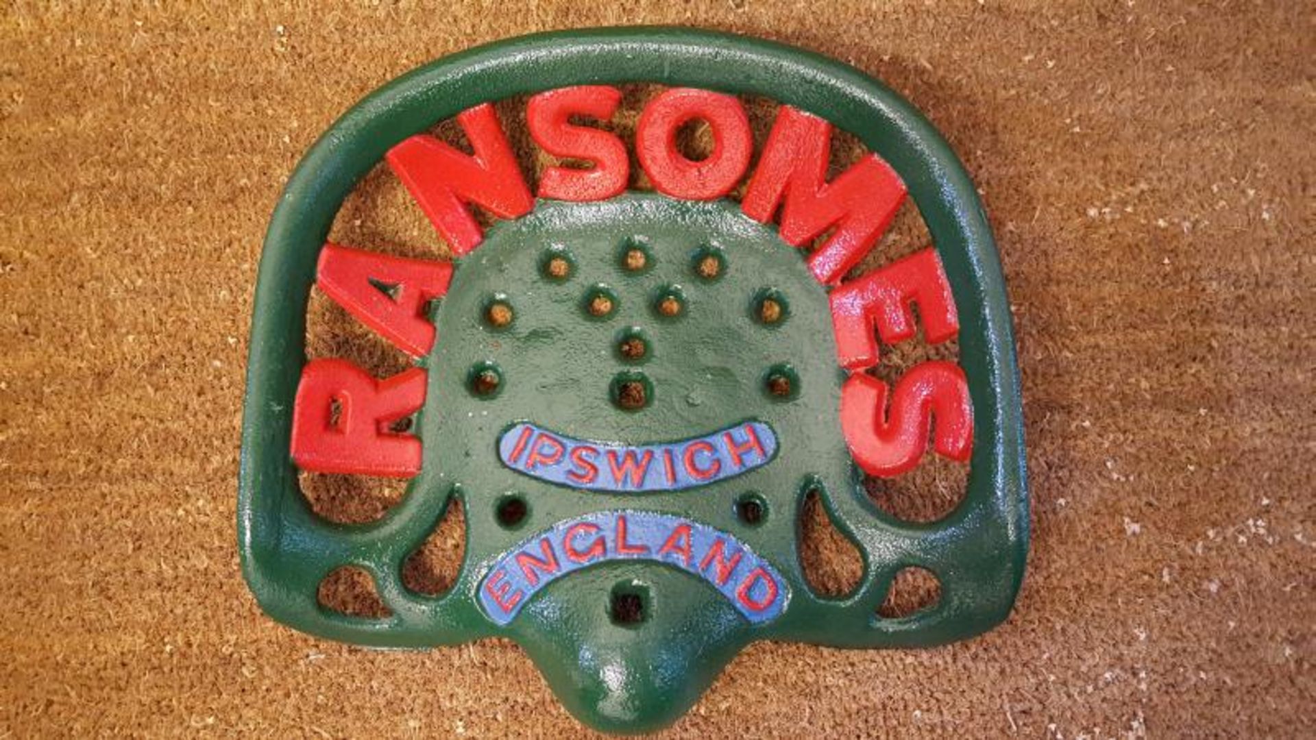 Ransomes - a cast iron seat